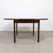 Extendable round rosewood dining table