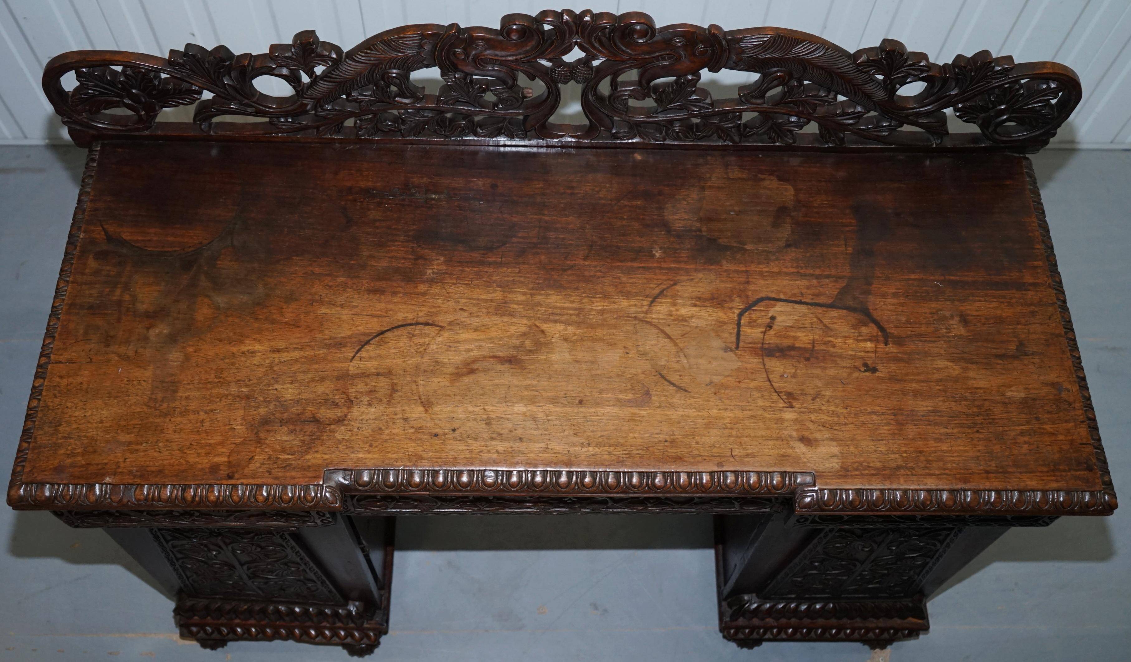 19th-century hand-carved Anglo-Burmese buffet with drawers and cupboards.