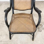 Antique black bentwood and cane lounge armchair by Thonet 19th century