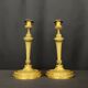 Pair of gilded bronze candlesticks in the Louis XVI style