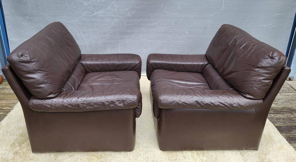 Pair of chocolate leather lounge chairs