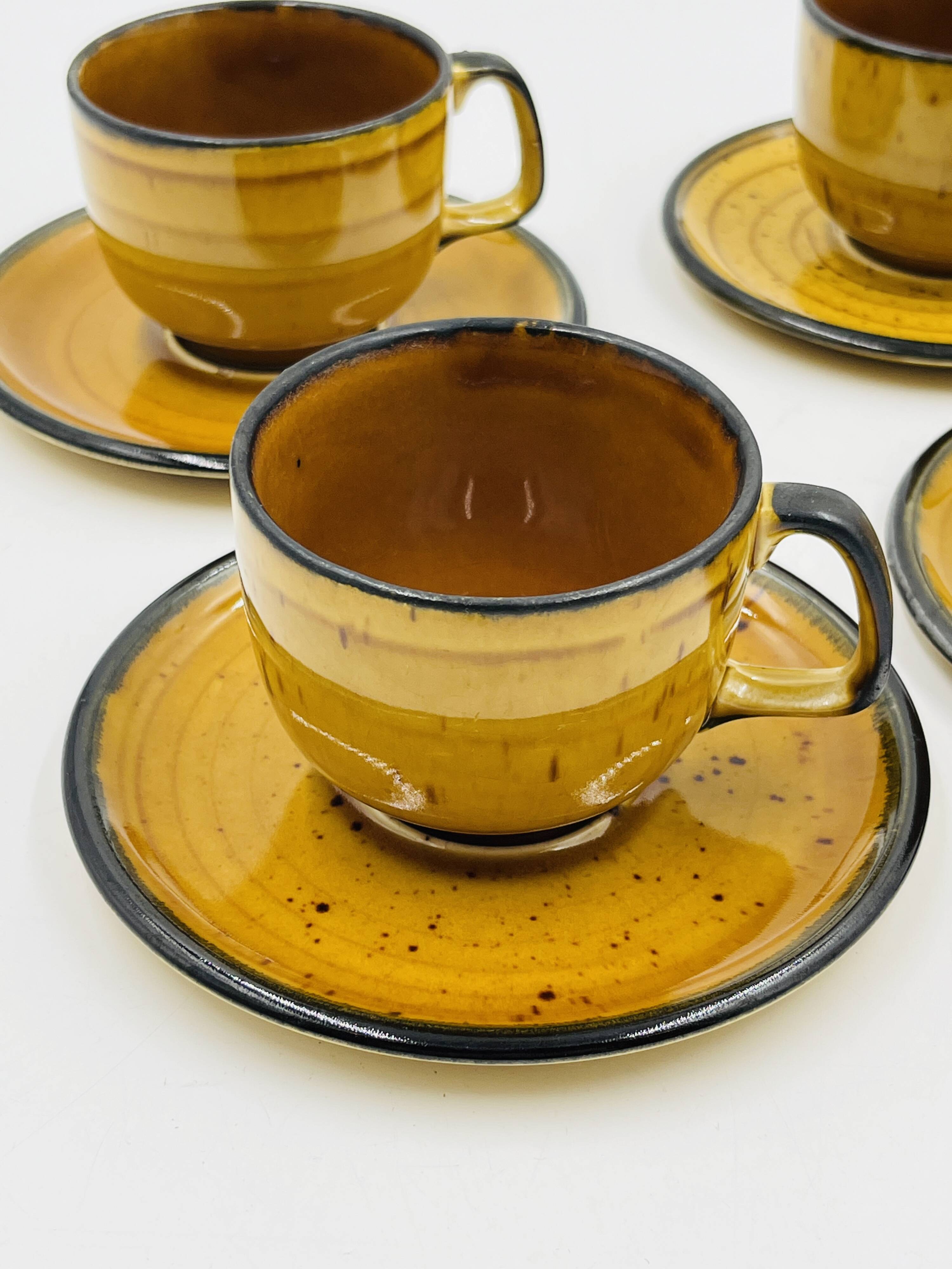 Set of four vintage Boch Palma cups and saucers.