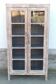 Armoire vitrée en bois ancien blanchi