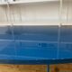 Table basse ovale en bois laqué bleu
