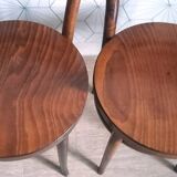 Set of 4 Baumann bistro chairs with round seats.