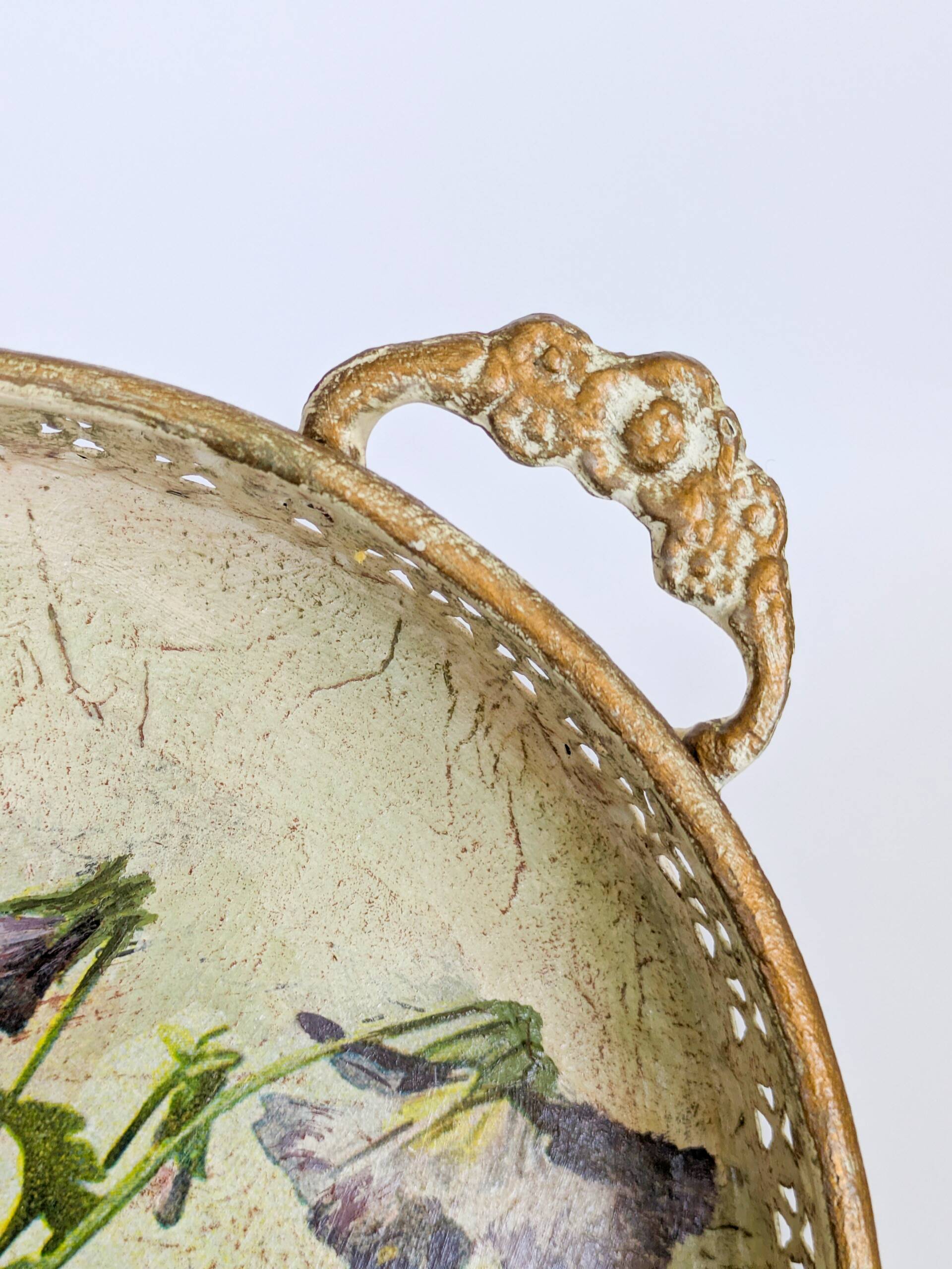 Oval metal decorative vintage tray with floral pattern.