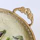 Oval metal decorative vintage tray with floral pattern.