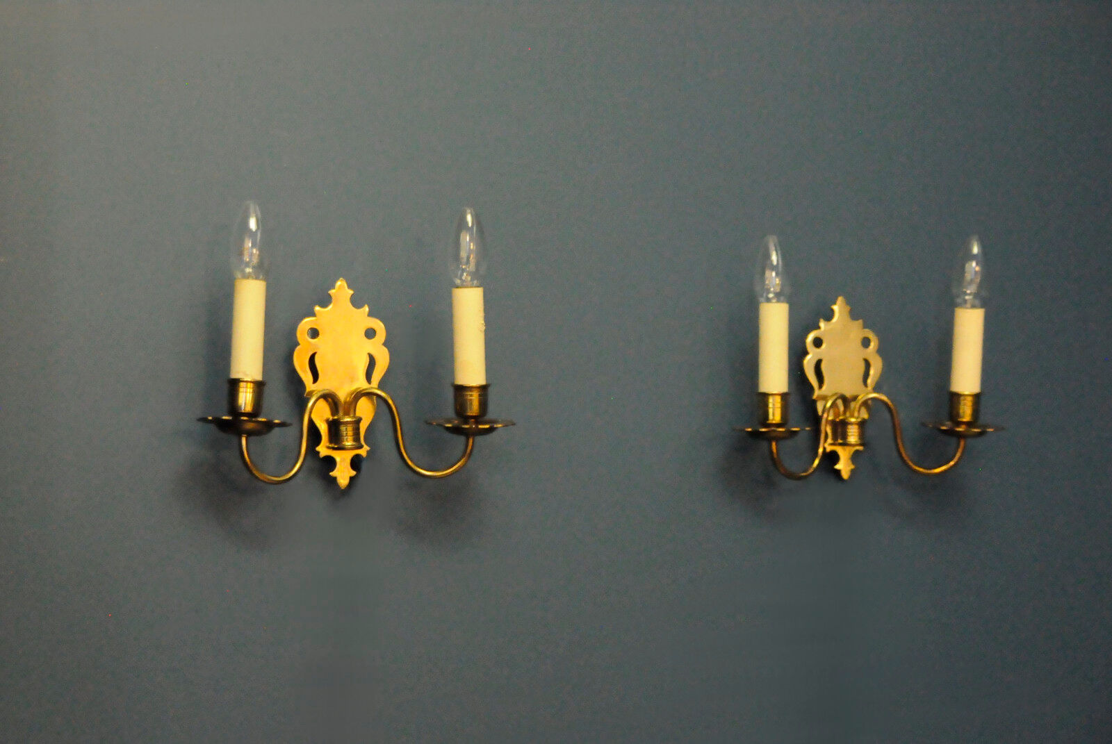 Pair of brass wall sconces by Schroder & Co