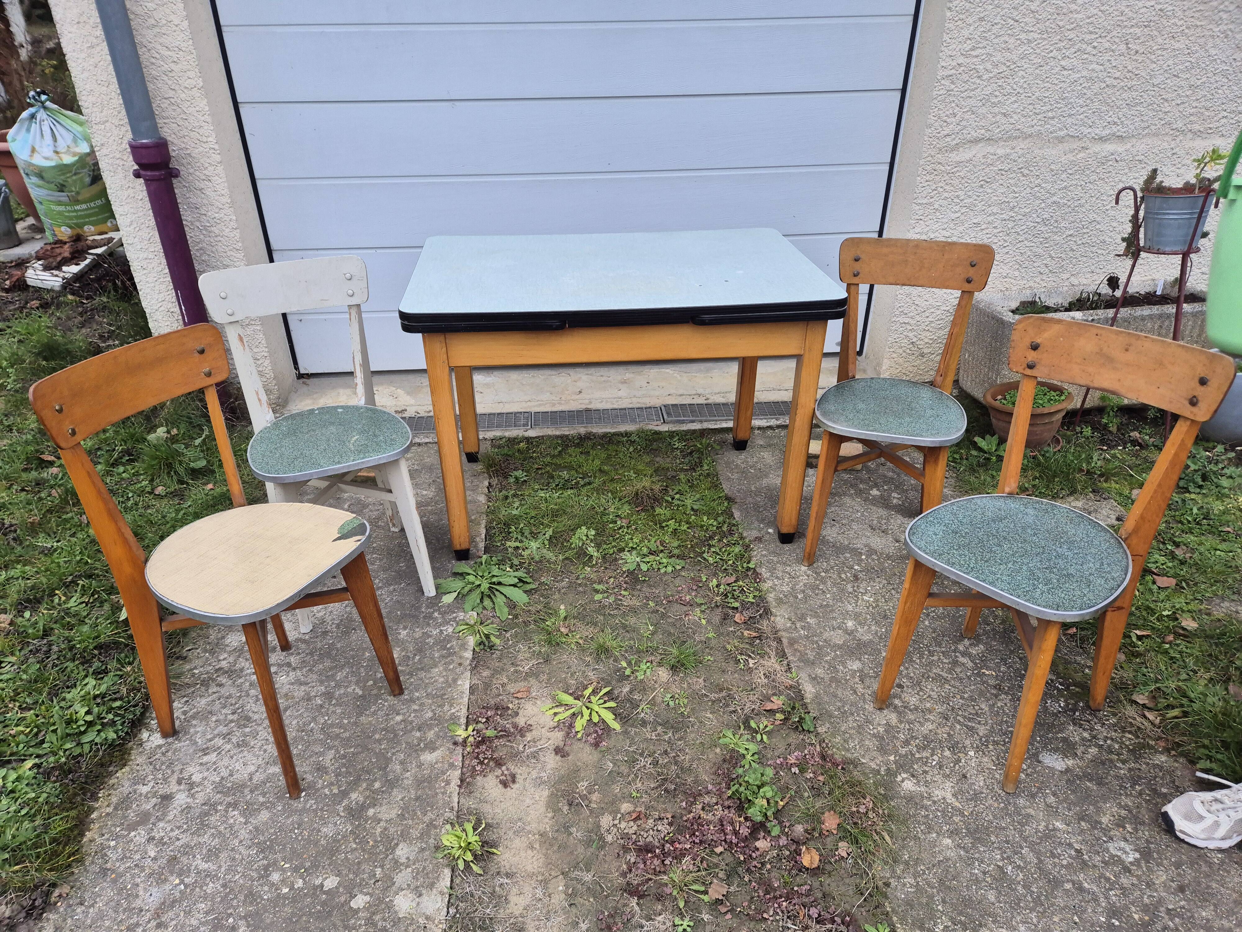 Vintage Scandinavian table and chair set with a wooden frame and formica top.