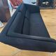 Black 3-seater sofa signed by a designer.