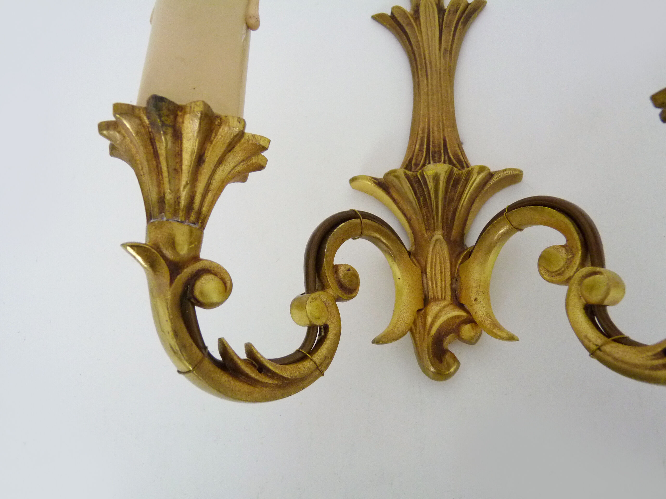 Old pair of wall sconces with double fires in bronze, seventies