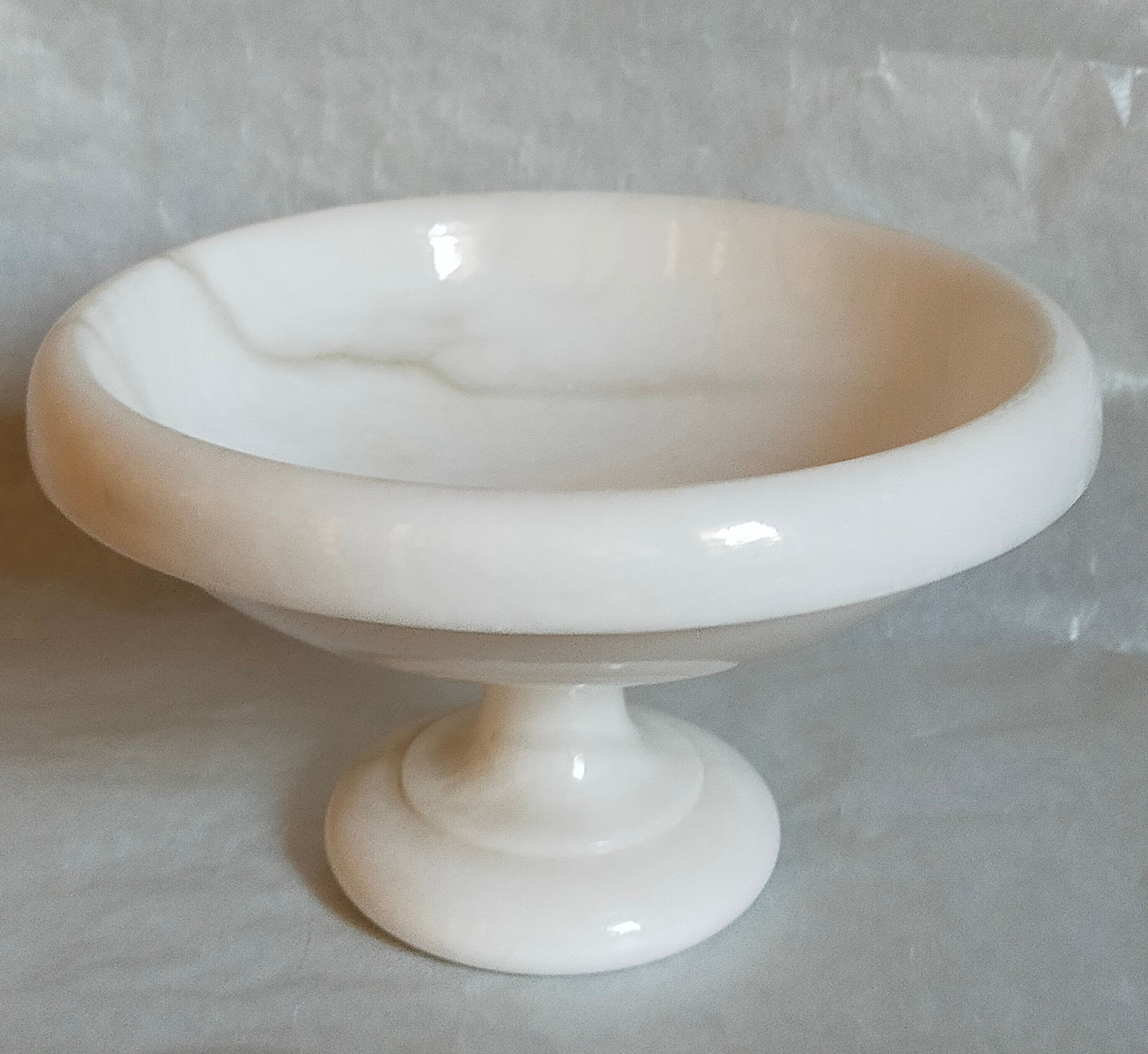 Standing cup in old white marble