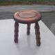Small vintage tripod stool made of turned wood, in the style of Charles.