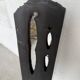 Brutalist hammered mirror, free-form, patinated metal.