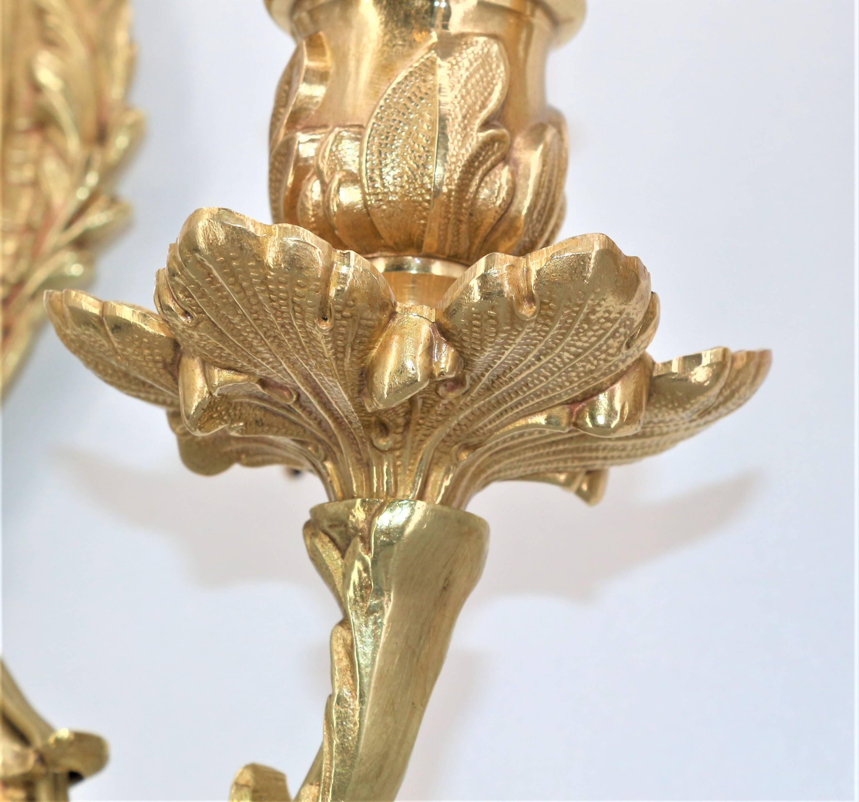 Pair of Louis XV style beveled mirror sconces in bronze by Lucien Gau