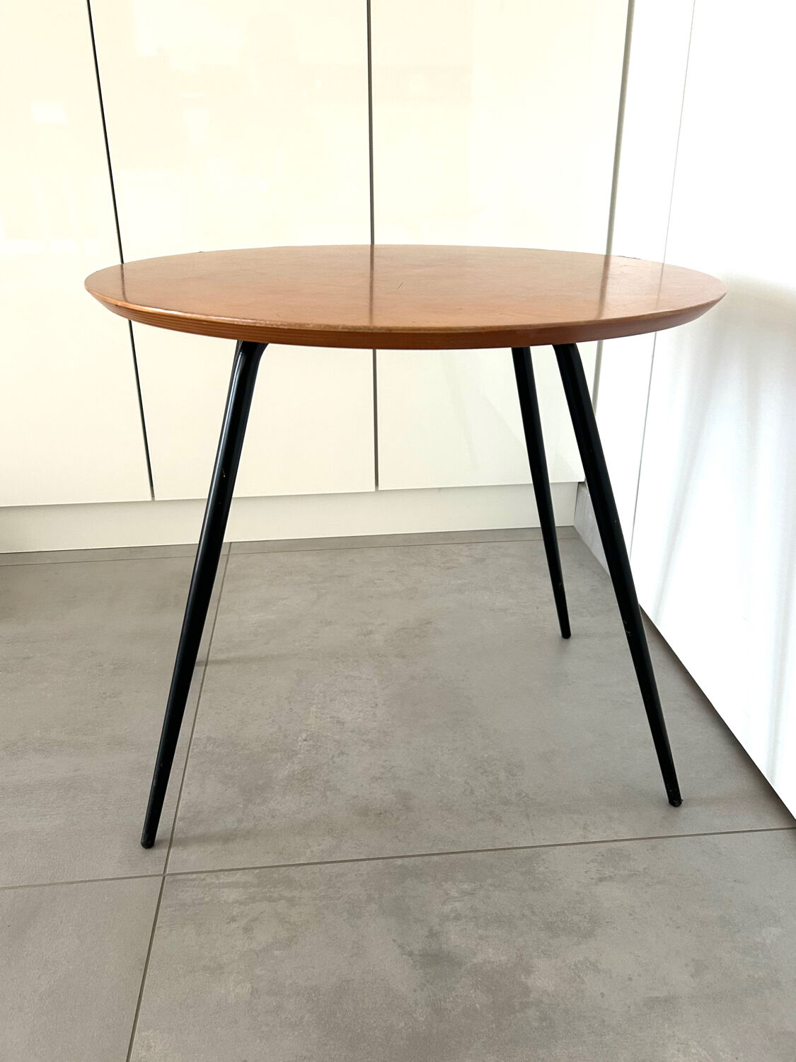 1970s coffee table in honey beech with black steel legs.