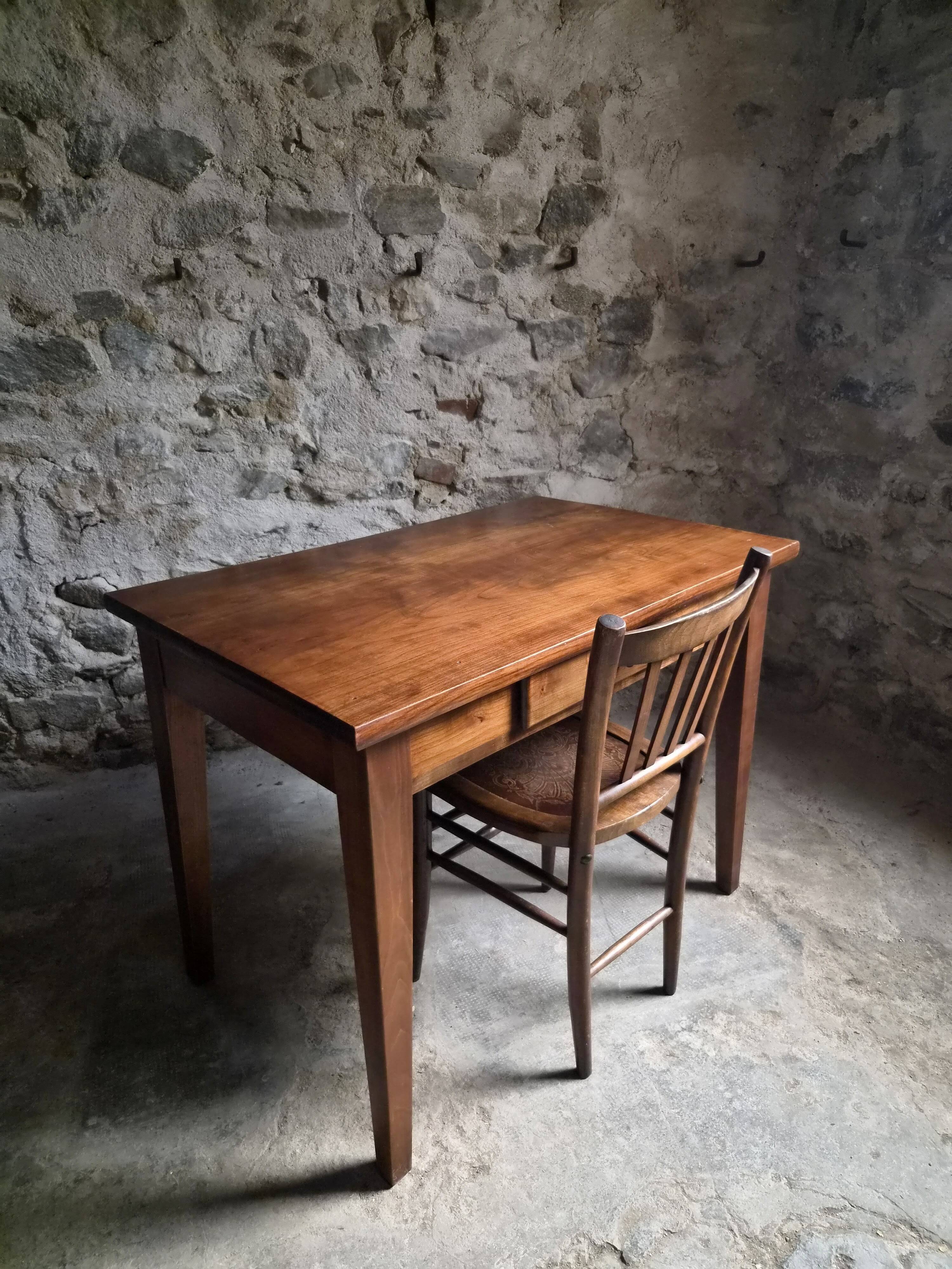 Old French table in cherry wood with bistro chair, circa 1900–1930.