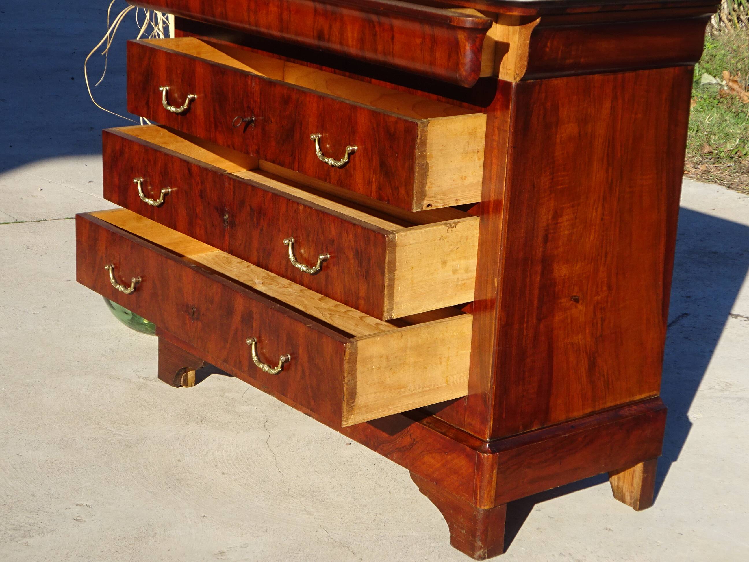 Antique mahogany chest of drawers with white marble.