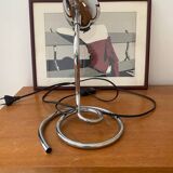 Chrome table lamp with spiral base and adjustable head. Halo brand