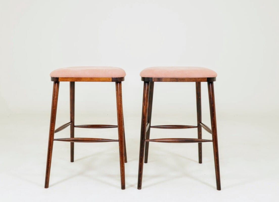 Bar stools matching the vintage style, in pink corduroy.