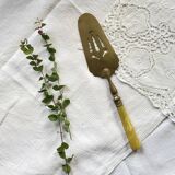 Pie server cake dessert in gold metal vintage silverware yellow bakelite handle