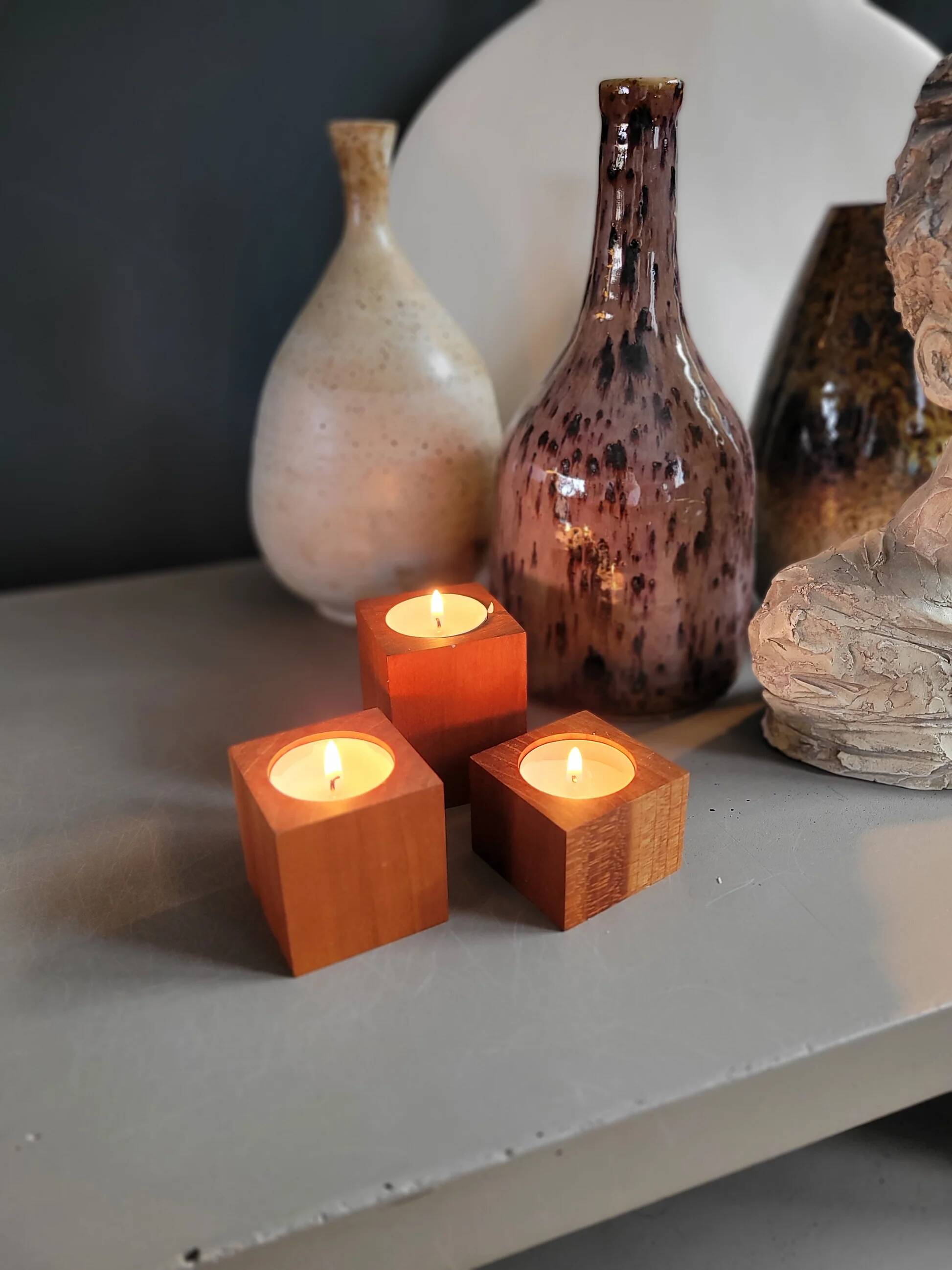 Vintage teak candlestick trio