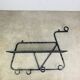 Wall-mounted coat rack/wardrobe from the 1950s, wrought iron and rigidule.