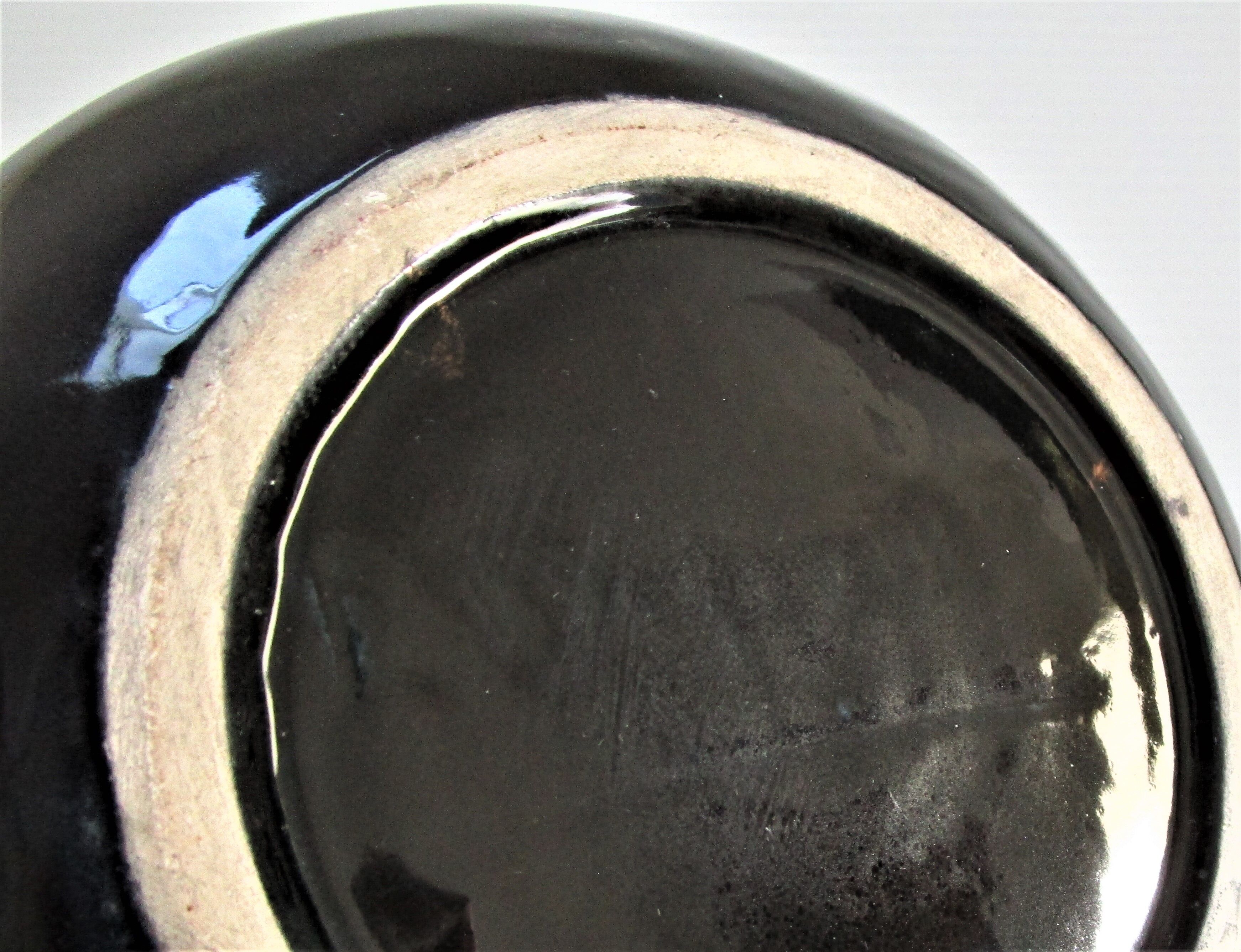 Black ceramic ashtray and vintage gold 50/60