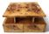 An Art Deco coffee table made of beech wood and elm burl with drawers.