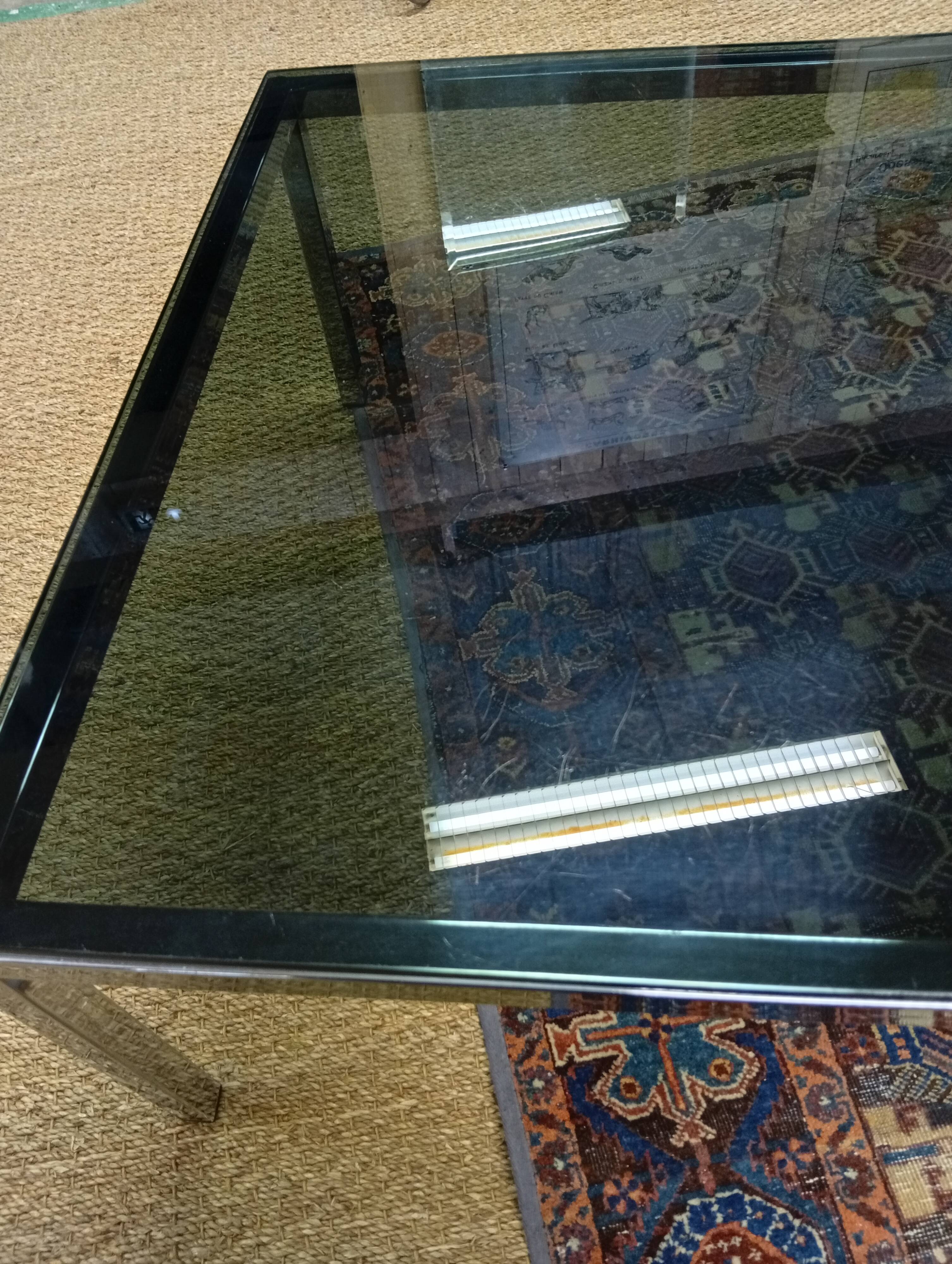 Chrome coffee table with a glass top from the 1980s.