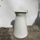 Old white enamelled metal pitcher