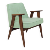 Fauteuil scandinave en tissu en laine pastel pistache, bois de chêne.