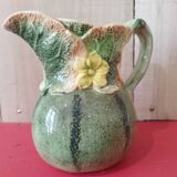 Green pitcher with zucchini patterns