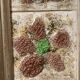 Large square ceramic mirror with floral decoration.