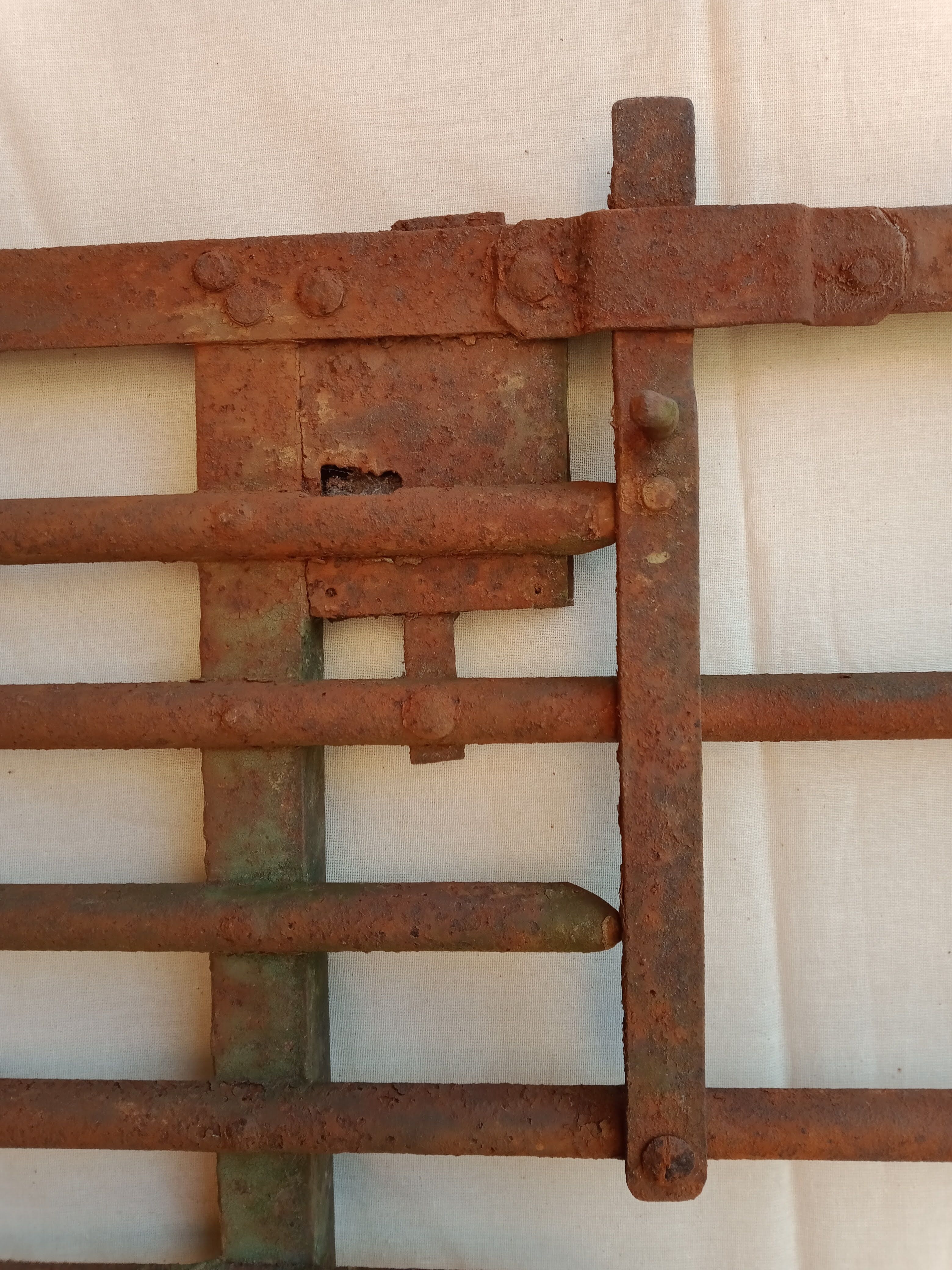 Old riveted metal gate