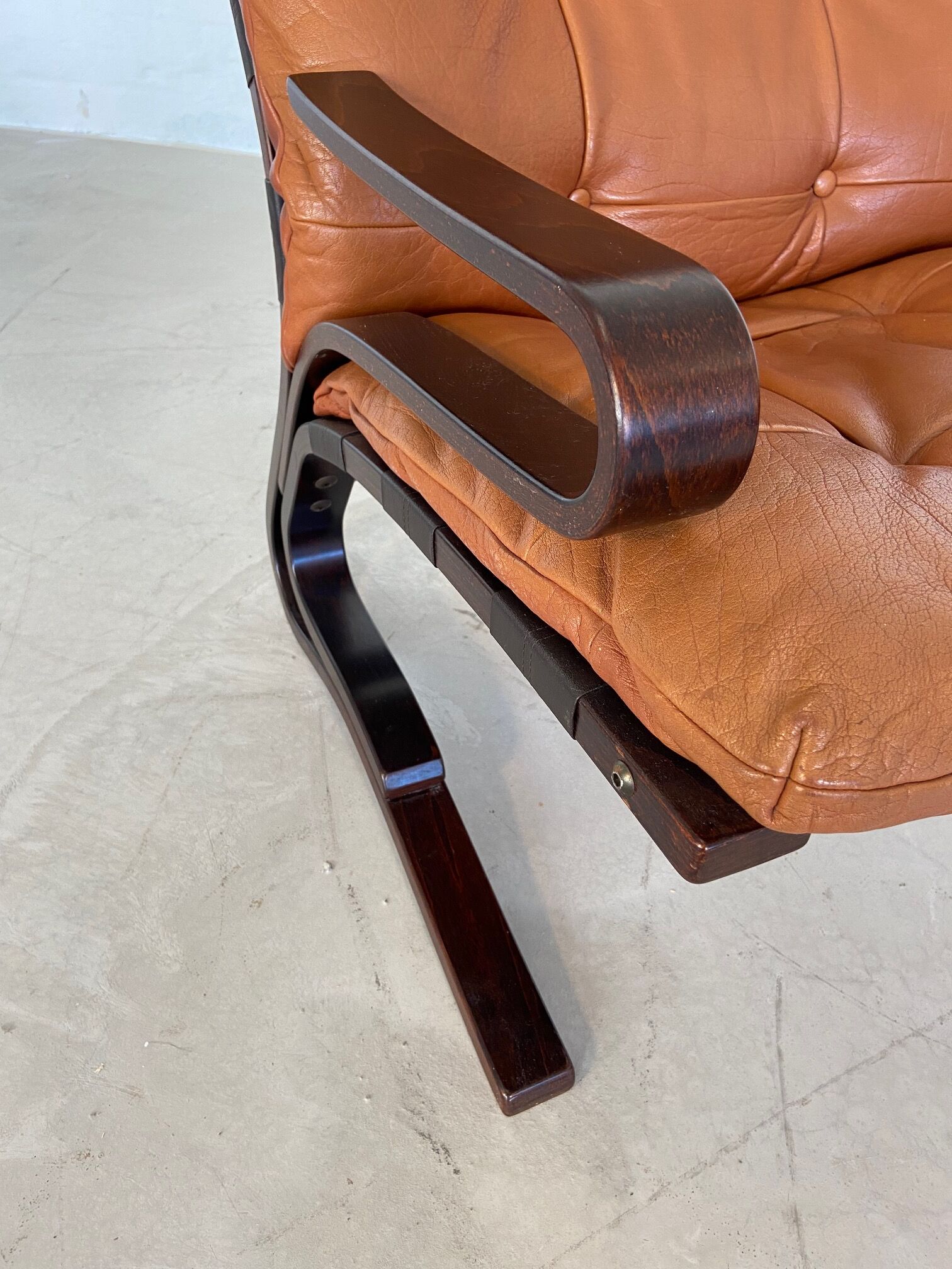 Vintage Scandinavian cognac lounge chair by Oddvin Rykken