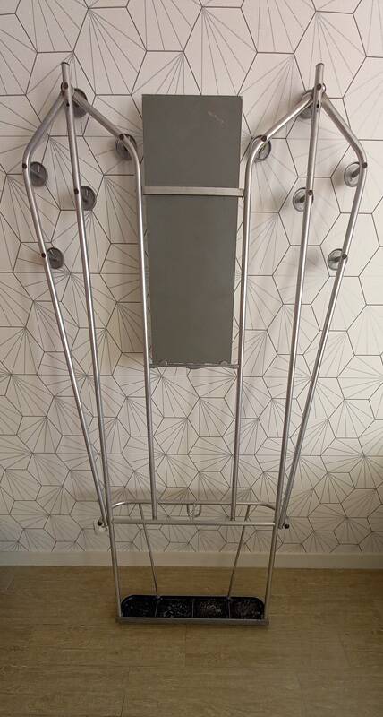 Vintage aluminum wall coat rack.