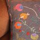 Colorful Suzani cushion in handmade embroidered wool
