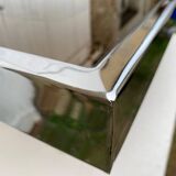 Coffee table with chrome base and mirrored glass top, vintage solar flare decor