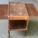 Extendable wooden bar trolley with a glass top from the 1930s.