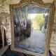 Large antique mirror in wood and gilded stucco.