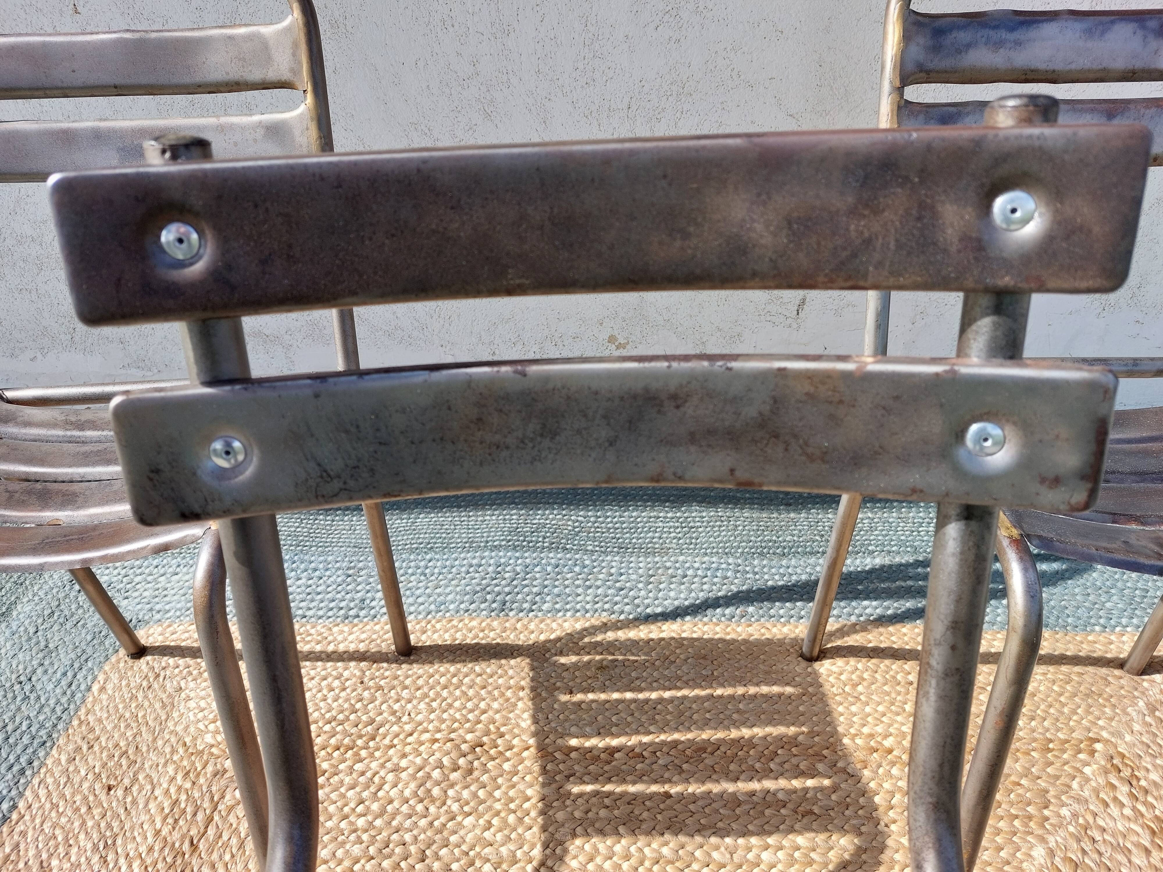 3 metal chairs, Tolix style