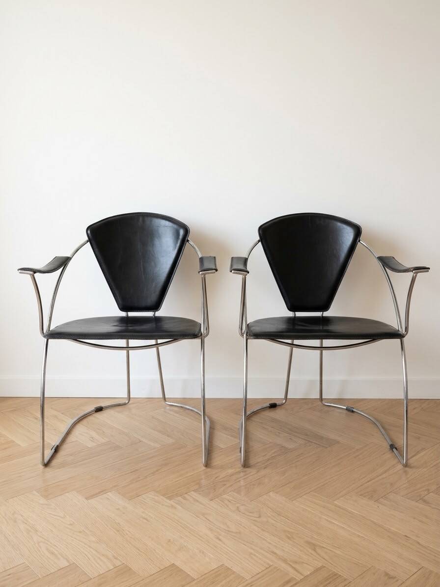 Pair of Linda Arrben armchairs from the 1970s in metal and black leather.