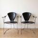 Pair of Linda Arrben armchairs from the 1970s in metal and black leather.