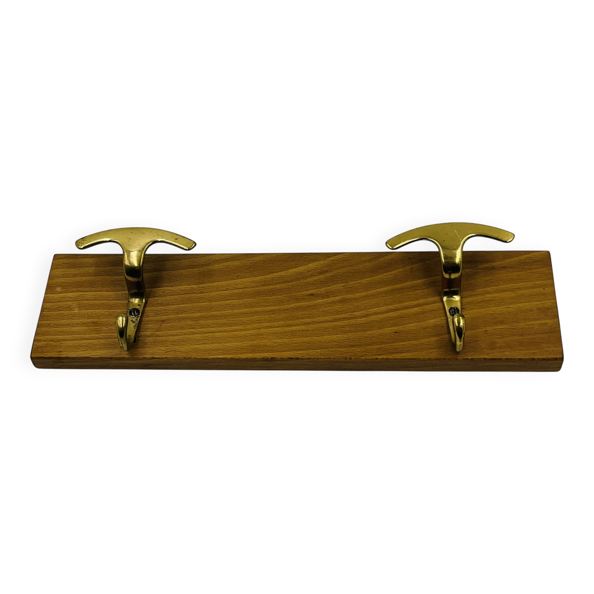 Vintage wall coat rack in brass and wood design.
