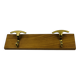 Vintage wall coat rack in brass and wood design.