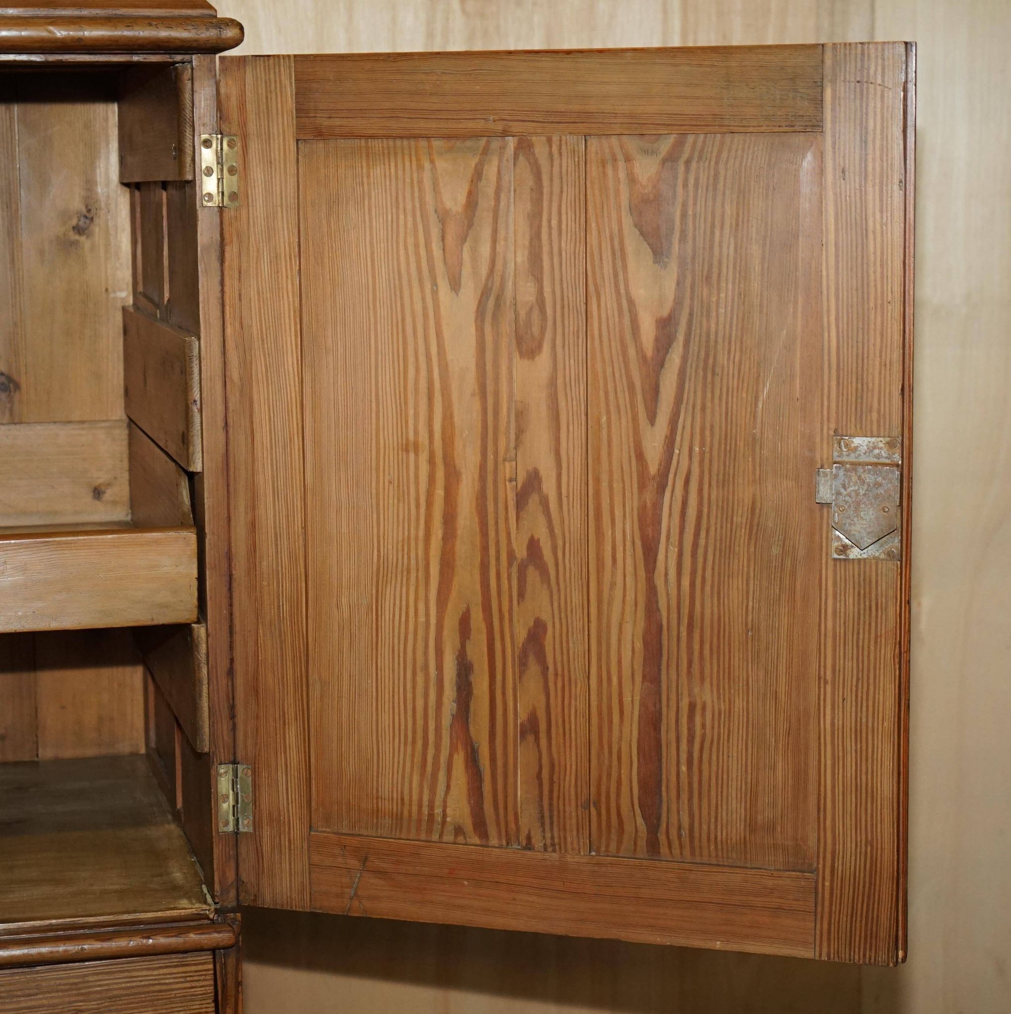 Antique Victorian pine governess buffet with sliding shelf.