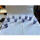 9 short glasses in purple glass
