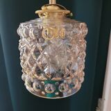 Moulded glass lamp with a cubic-spherical relief design.