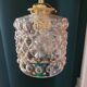 Moulded glass lamp with a cubic-spherical relief design.